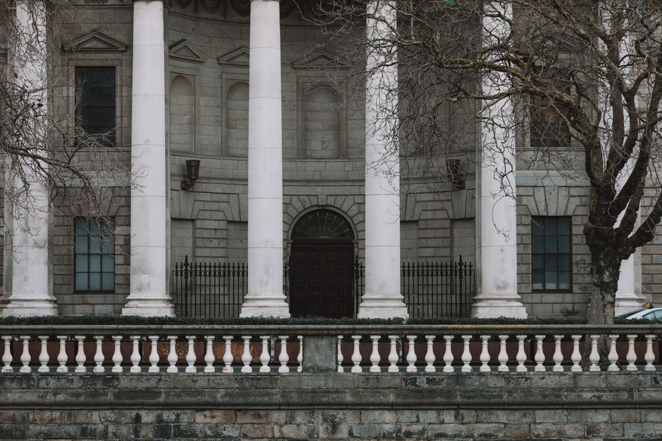 Elegant neoclassical facade of Dublin's Four Courts with iconic white columns.